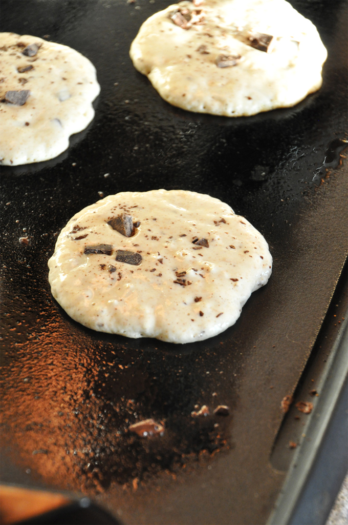 Cooking a batch of our Vegan Snickers Pancakes recipe on a griddle