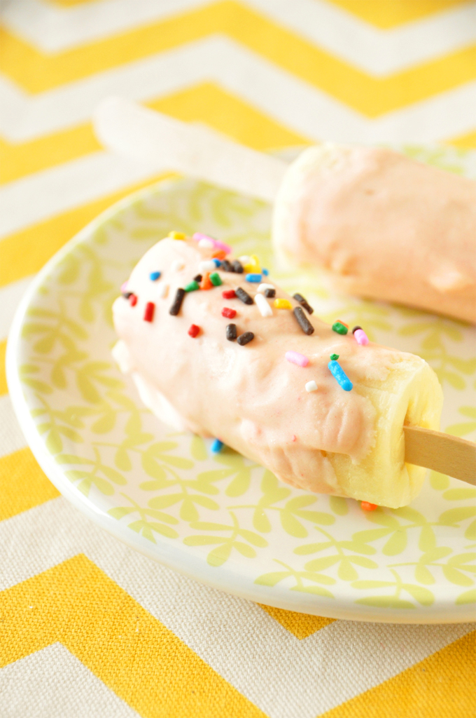 Banana pops topped with Strawberry Cake Magic Shell and sprinkles