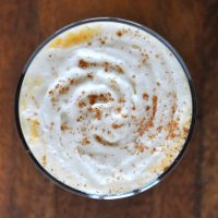 Top down shot of a glass of our Boozy Pumpkin White Hot Chocolate