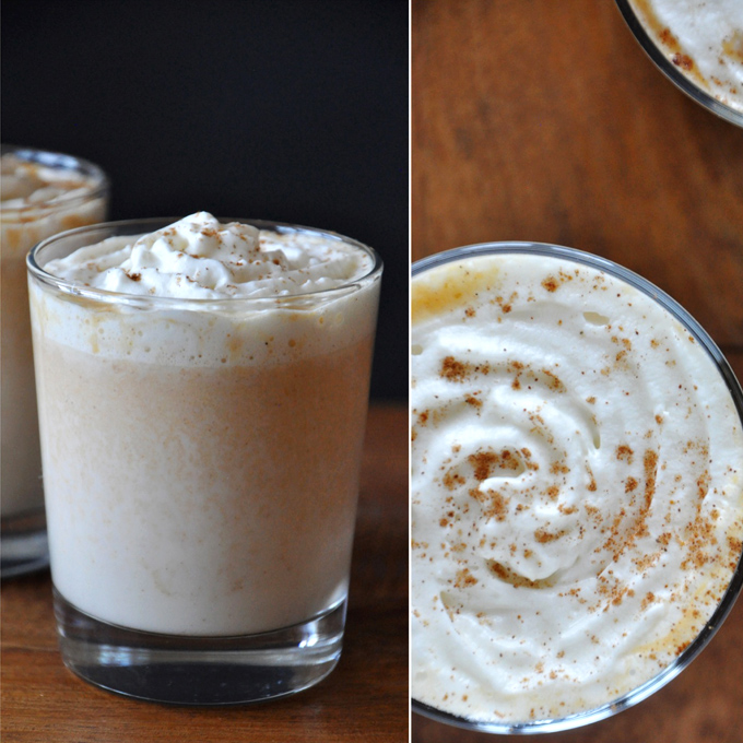 Glasses filled with our Boozy Pumpkin White Hot Chocolate recipe and whipped cream