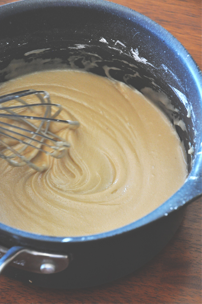 Whisking together icing ingredients for Pumpkin Cinnamon Roll Cookies