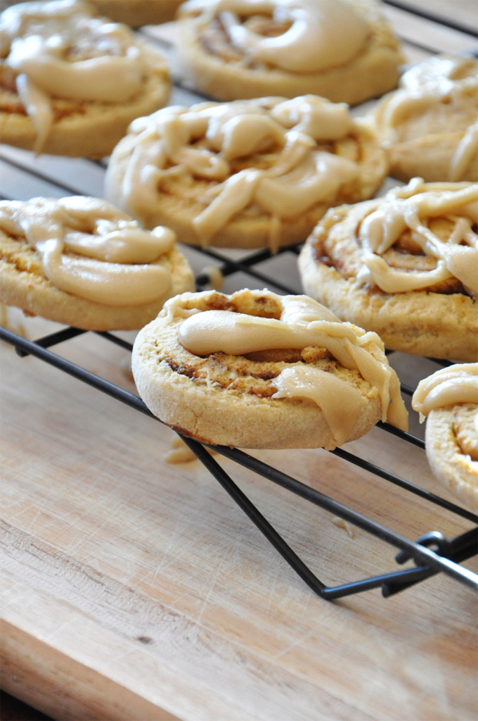 Close up shot of Pumpkin Cinnamon Roll Cookies on a cooling rack
