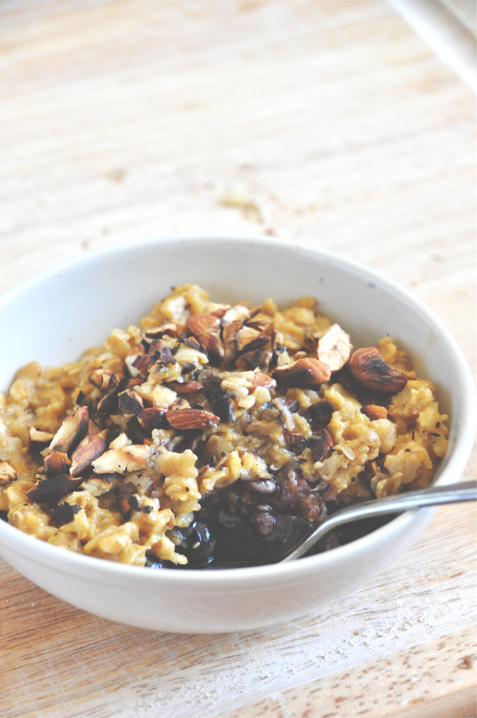 Bowl of gluten-free vegan Pumpkin Oats with Blueberries and Toasted Almonds