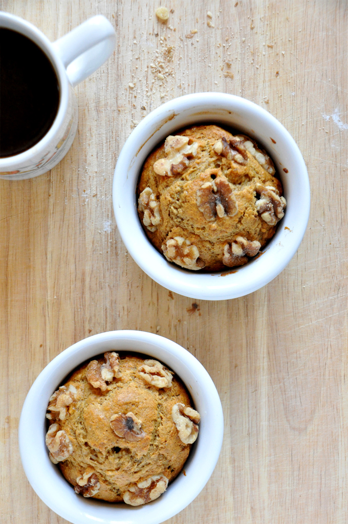 Cup of coffee alongside ramekins filled with our Vegan Banana Nut Muffins for 2 recipe