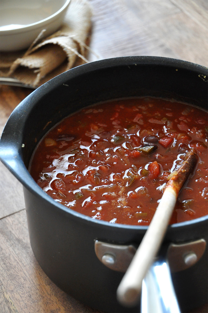 Stirring a pot of homemade Vegan Beer Chili