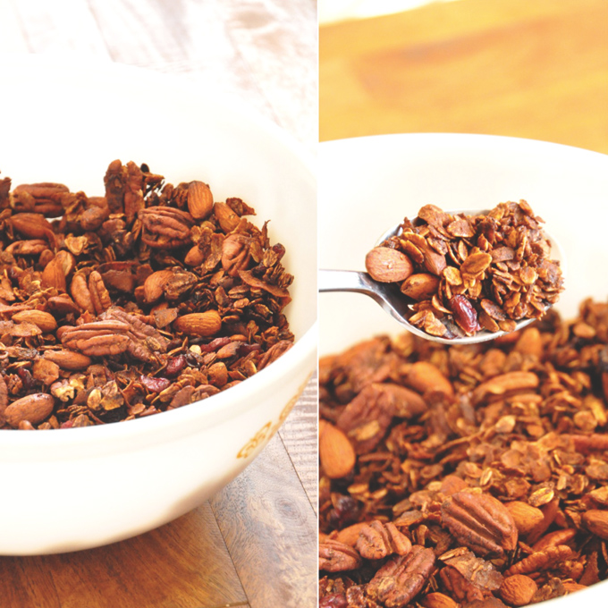 Holding up a spoonful of Nut and Honey Coconut Granola made with almonds and pecans