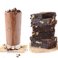 Tall glass of our Chocolate Brownie Batter Blizzard recipe beside a stack of homemade Vegan Brownies