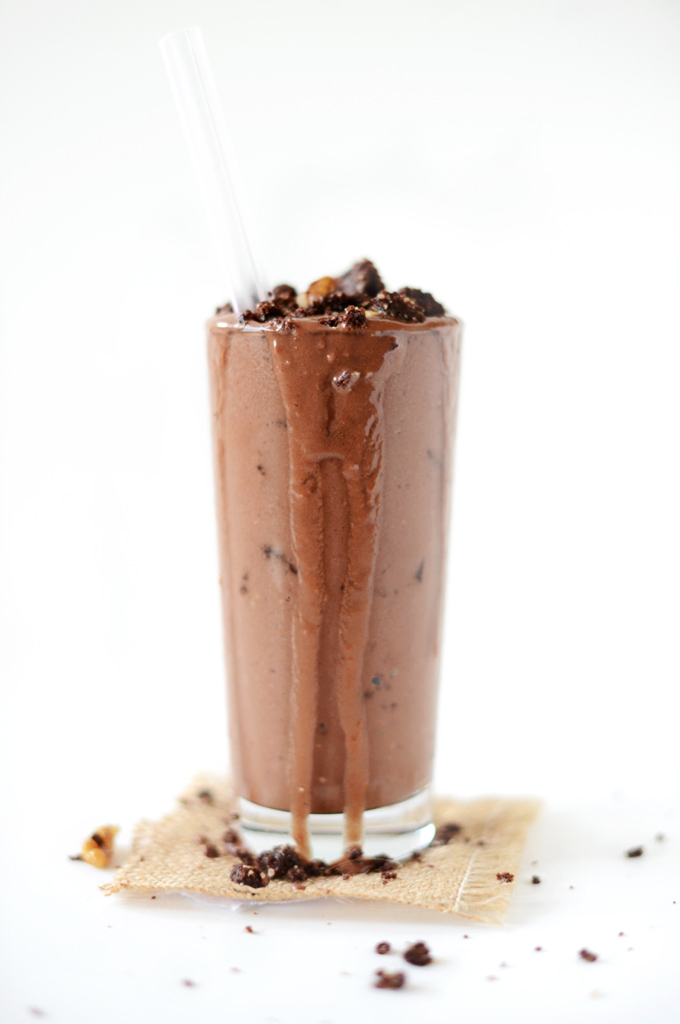 Tall glass overflowing with our Vegan Brownie Batter Blizzard recipe