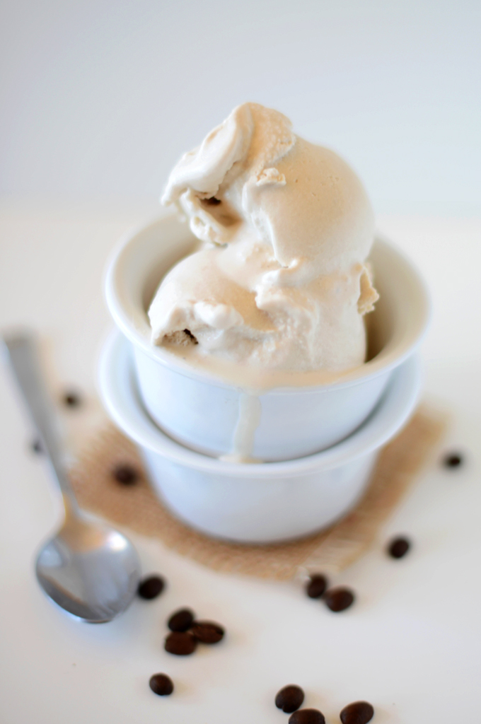 Scoops of Coffee Coconut Ice Cream in a bowl with melted ice cream dripping down the side