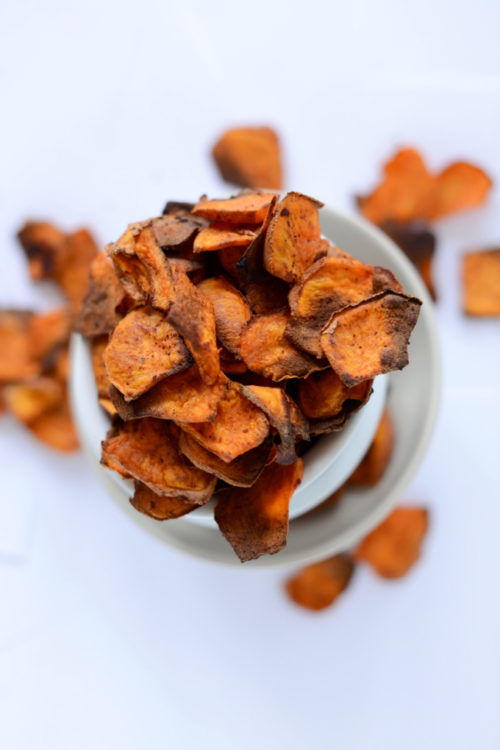 Bowl piled high with a batch of our homemade Spicy Sweet Potato Chips