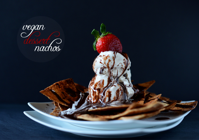 Plate of Vegan Dessert Nachos topped with ice cream, chocolate sauce, and a strawberry