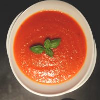 Big bowl of our simple Vegan Roasted Red Pepper Tomato Soup recipe