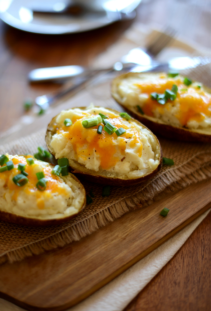 Batch of our Cheesy Cauliflower Baked Potatoes topped with green onion