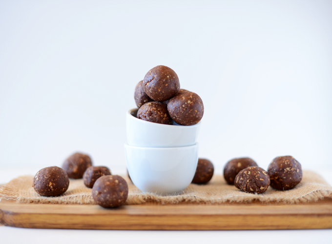 Bowl and cutting board scattered with No-Bake Chocolate Peanut Butter Cookie Truffles