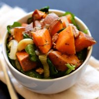 Bowl of Warm Sweet Potato Spinach Salad for a delicious vegan side dish