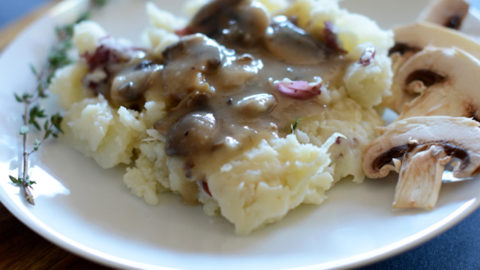 Plate of Cauliflower Mashed Potatoes with Mushroom Gravy for a vegan Thanksgiving