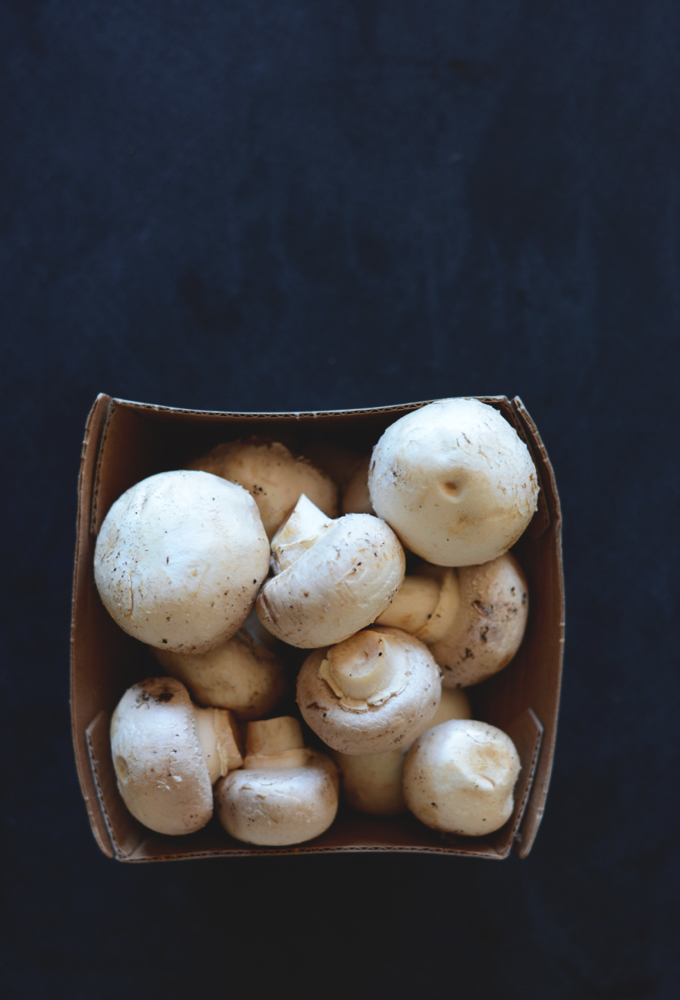 Carton of fresh button mushrooms