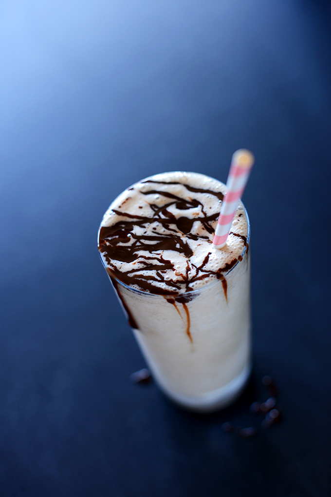 Tall glass of Blended Vegan White Russian topped with chocolate sauce