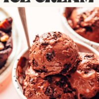 Bowl with two spoons and three scoops of vegan gluten-free brownie chocolate ice cream