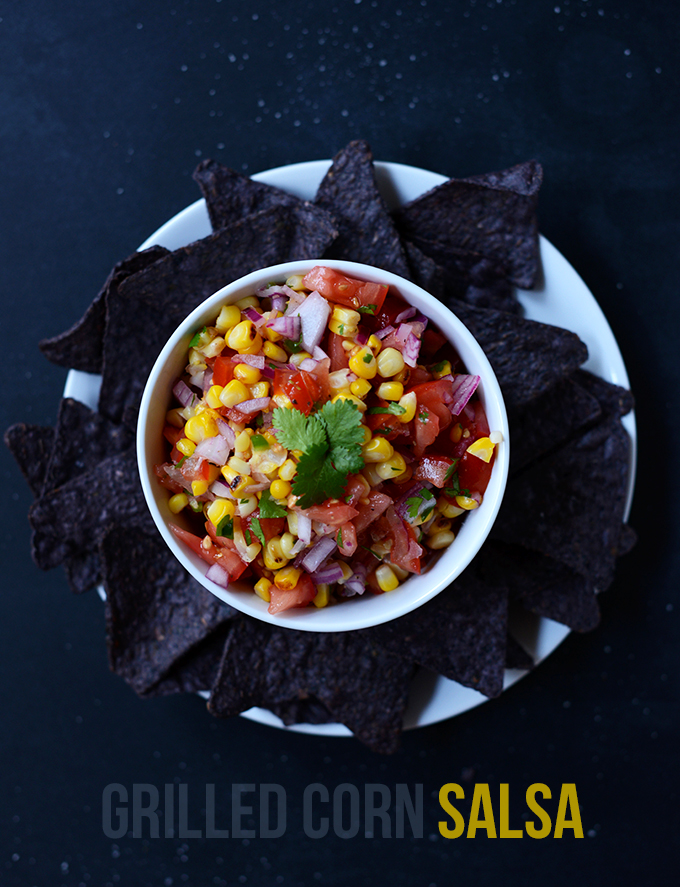 Bowl of our Simple Grilled Corn Salsa recipe surrounded by tortilla chips
