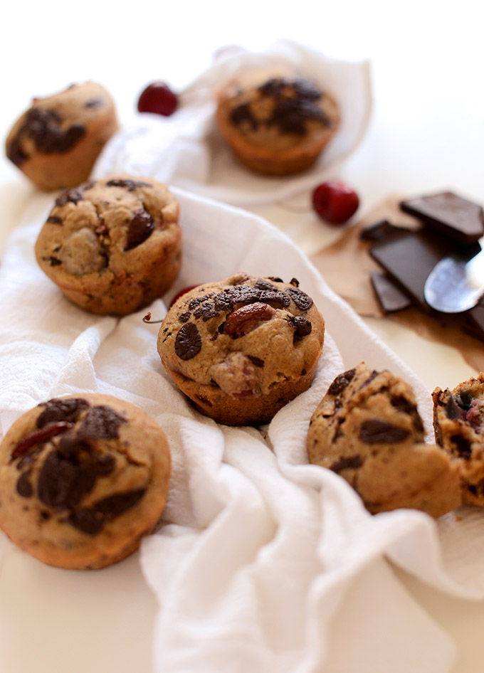 Batch of Cherry Dark Chocolate Chip Muffins resting on a kitchen towel