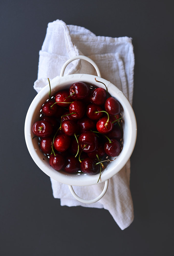 Colander of fresh cherries for making our chocolate cherry muffins recipe