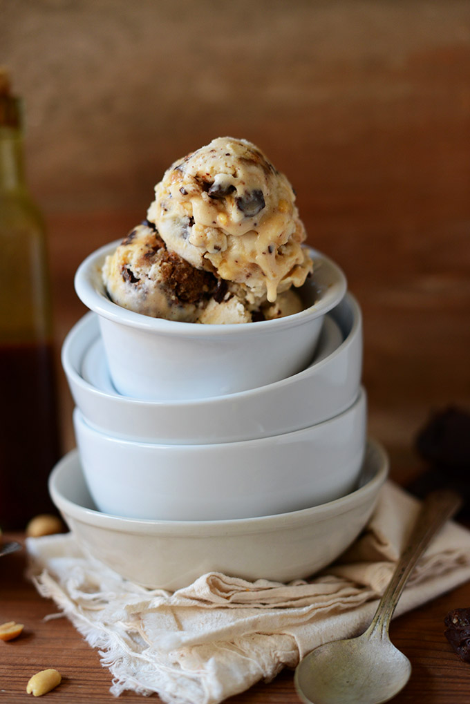 Stack of bowls with the top one filled with Vegan Snickers Ice Cream