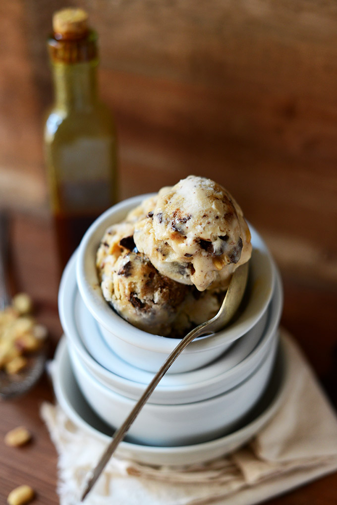 Scoops of Vegan Snickers Ice Cream in a bowl stacked on other bowls