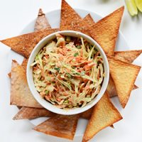 Bowl of Creamy Thai Slaw surrounded by Baked Wonton Chips