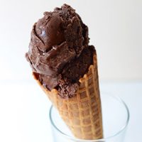 Waffle cone holding scoops of Vegan Chocolate Ice Cream