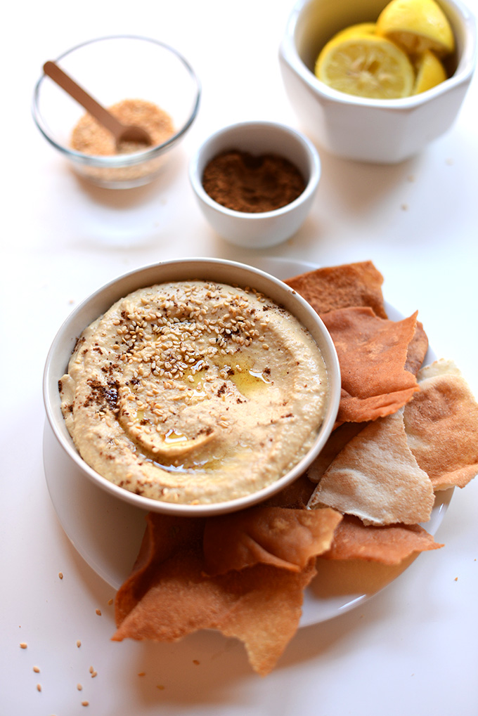 Pita chips and a bowl of our Garam Masala Hummus recipe