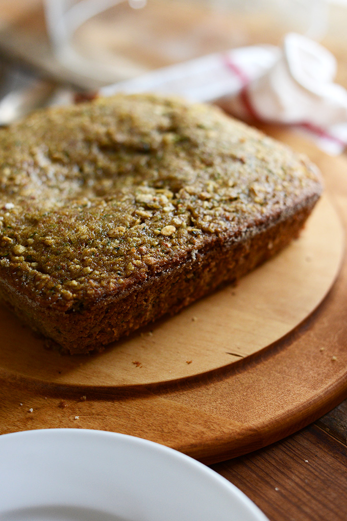 Loaf of Gluten-Free Zucchini Cake on a cutting board