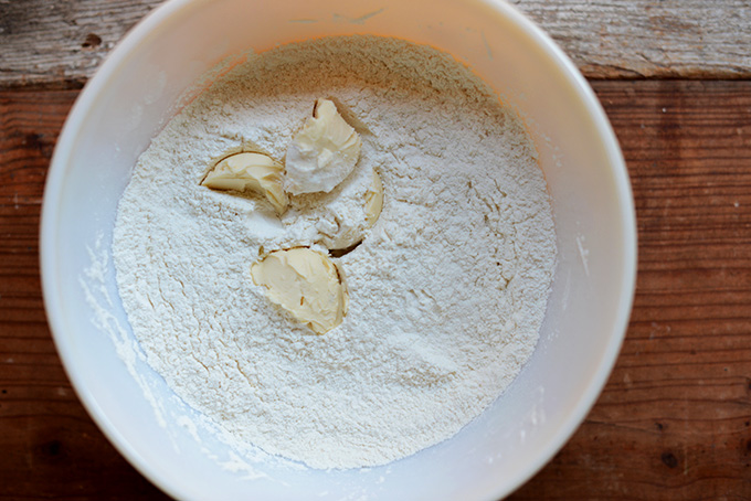 Vegan butter in a bowl of dry ingredients