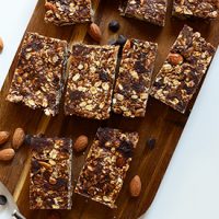 Cutting board filled with homemade Chocolate Chip Almond Butter Bars