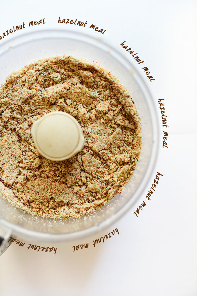 Food processor filled with homemade hazelnut meal 