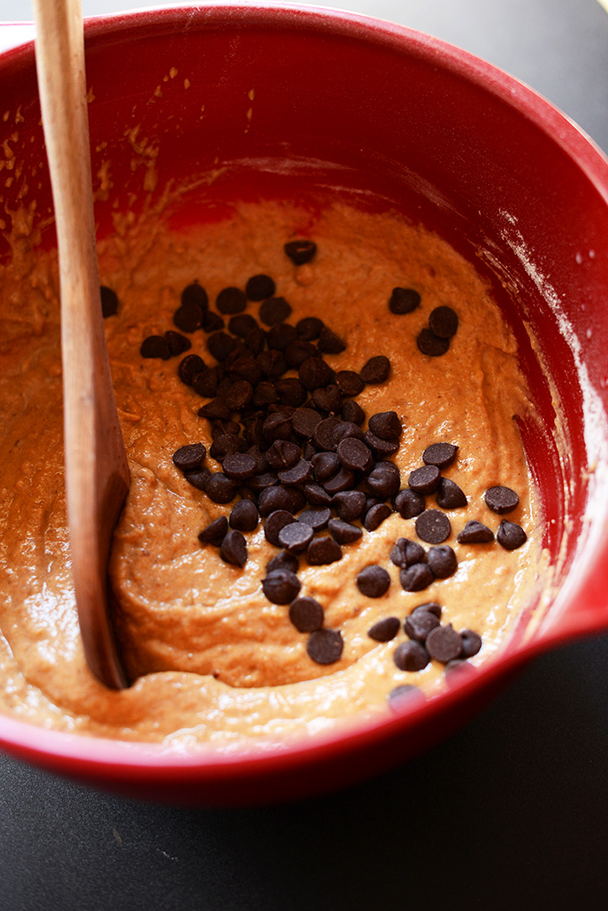 Stirring chocolate chips into vegan muffin batter