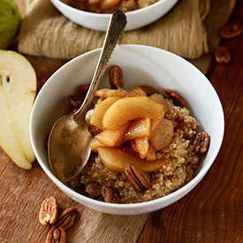 Bowl of Brown Sugar Pear Steel Cut Oats topped with pecans