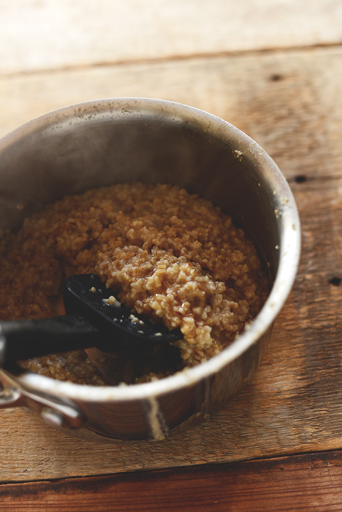 Cooking oats in a saucepan for our Brown Sugar Pear Steel-Cut Oats recipe