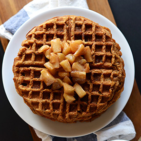 Top down shot of a plate stacked with Vegan Apple Cinnamon Waffles