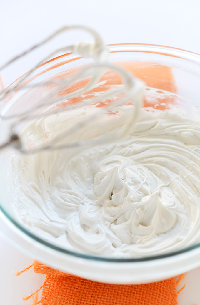 Showing how to make Coconut Whipped Cream with a hand mixer