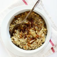 Spoon in a bowl of Creamy Eggplant & Caramelized Onion Dip