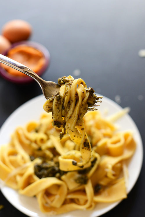 Holding up a bite of Fresh Pumpkin Pasta with pesto