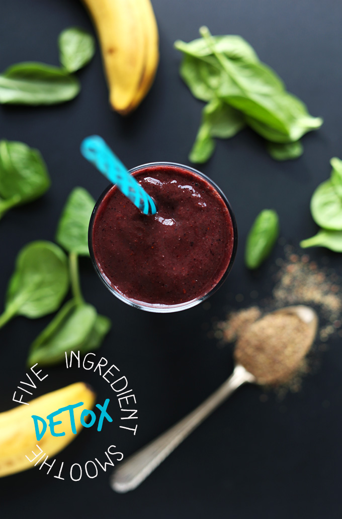 Glass of our 5-Ingredient Detox Smoothie recipe surrounded by ingredients used to make it