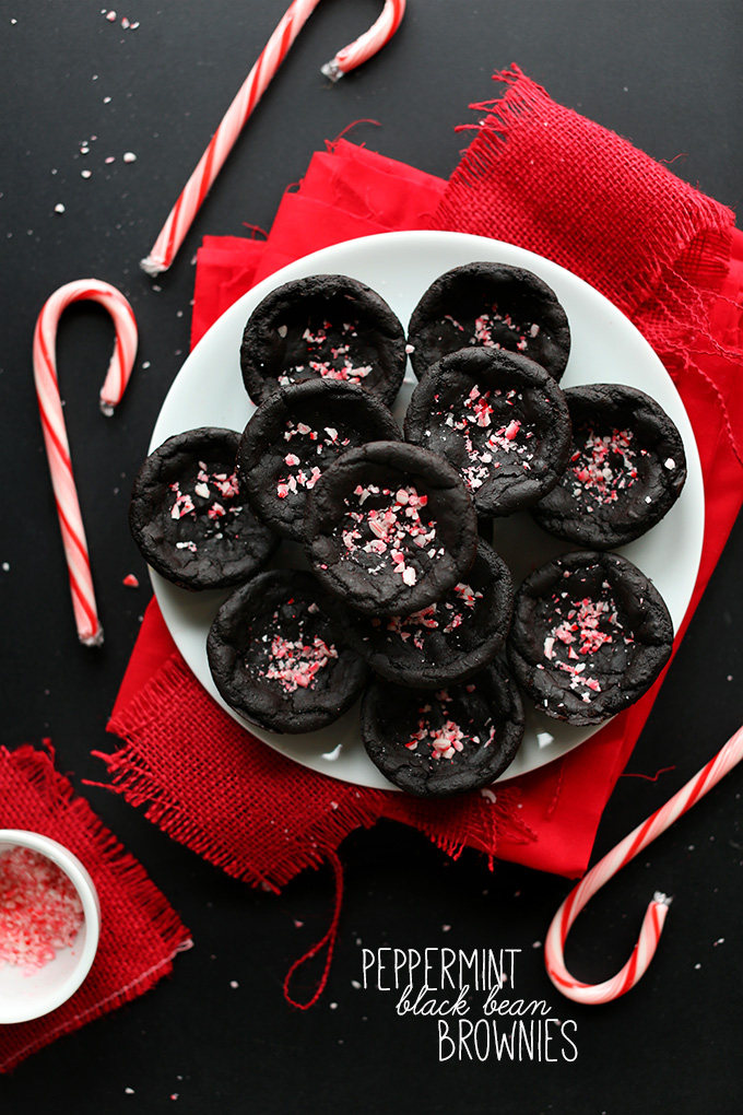 Candy canes surrounding a plate of Peppermint Black Bean Brownies