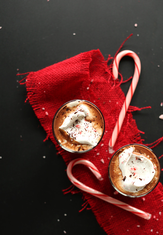 Glasses of Vegan Peppermint Drinking Chocolate topped with coconut whipped cream