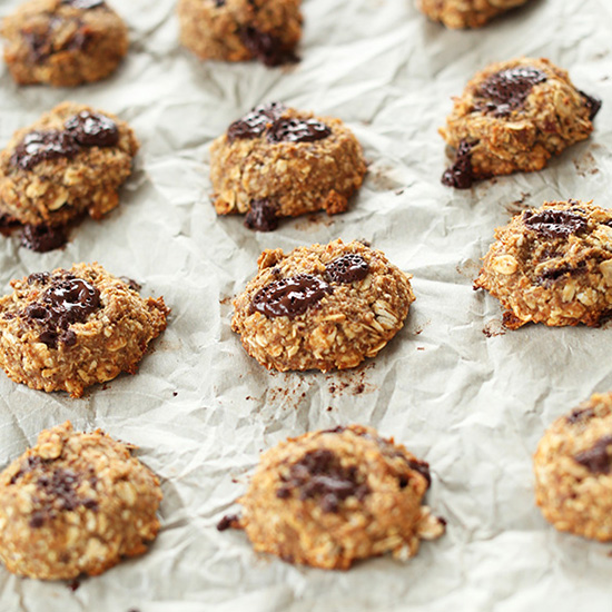 Parchment-lined baking sheet filled with freshly baked Healthy Vegan Cookies