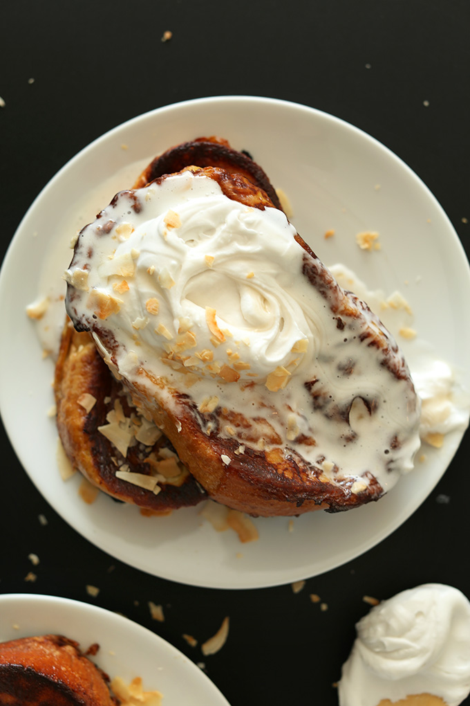 Plate of Coconut Cream Pie French Toast with coconut whipped cream on top