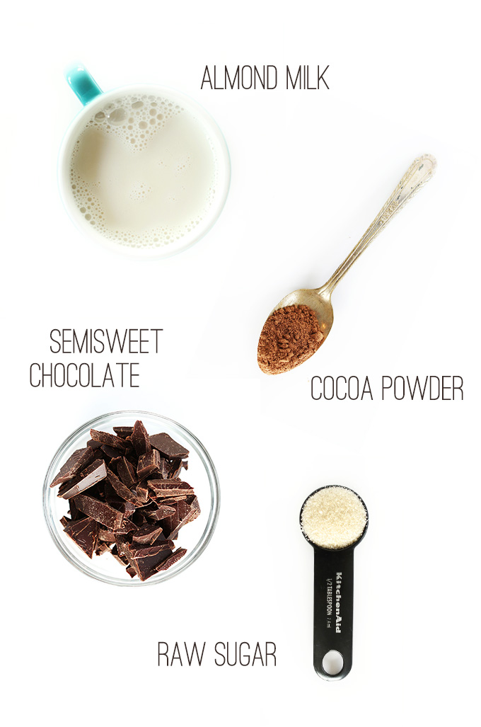 Almond milk, chocolate, cocoa powder, and sugar for making homemade Vegan Hot Cocoa