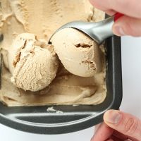 Using an ice cream scoop to pick up scoops of Vegan Chai Ice Cream