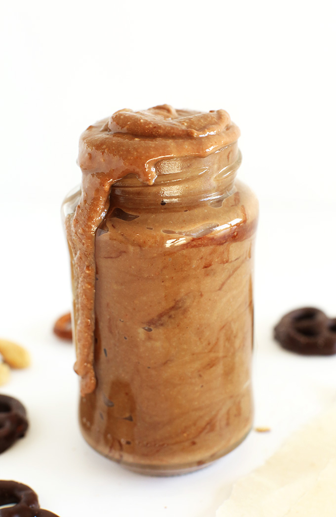 Overflowing jar full of our Chocolate Covered Pretzel Peanut Butter recipe